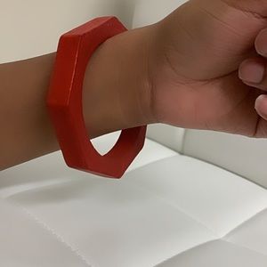 Red bracelet (made out of wood)